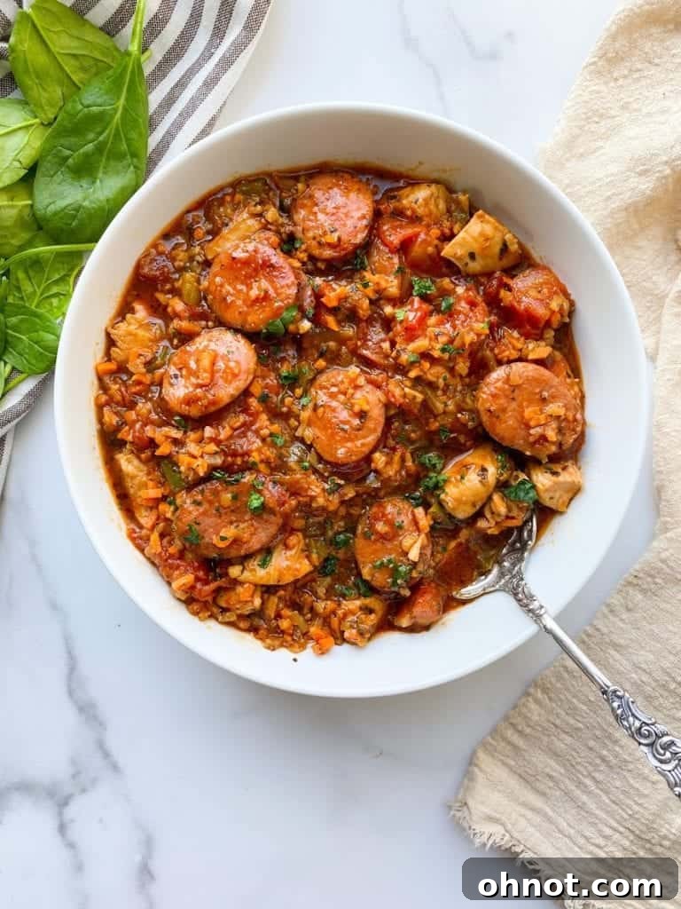 Hearty and flavorful Whole30 Chicken Jambalaya, a one-skillet Paleo meal made with riced cauliflower.