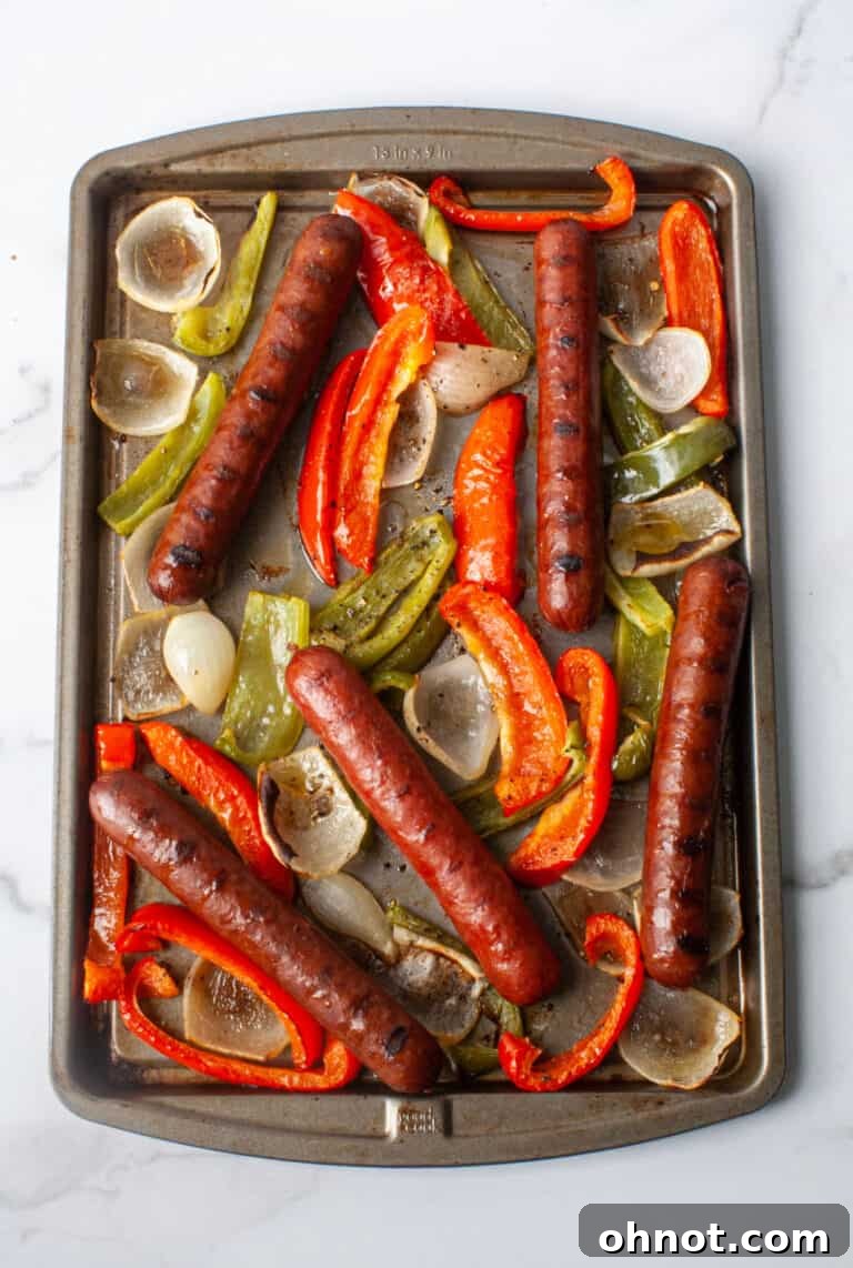 Whole30 Sausage, Peppers, and Onions, a quick and easy sheet pan meal with smoky sausage and oven-roasted vegetables.