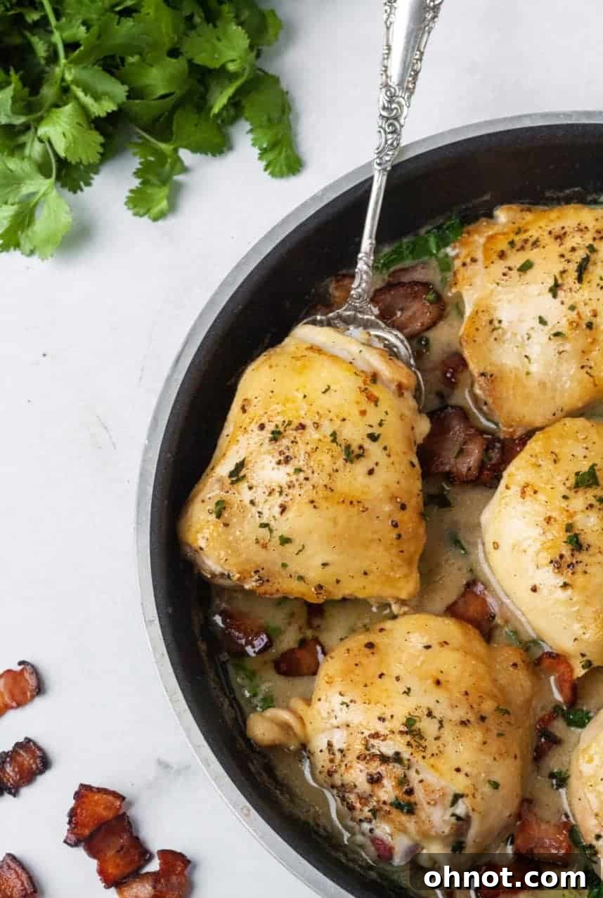 Whole30 Creamy Spinach Bacon Chicken, a delicious skillet meal with crispy bacon, juicy chicken, and creamy spinach sauce.