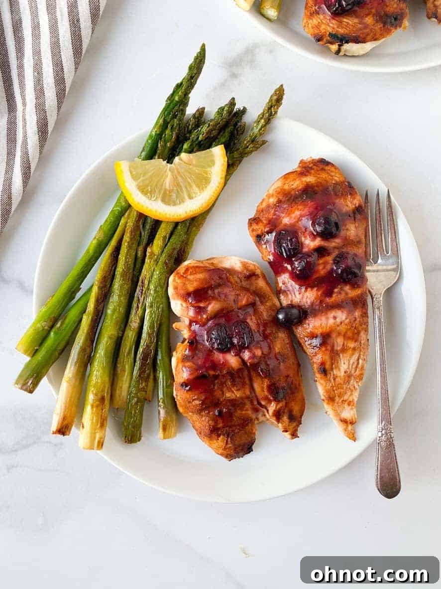 Grilled Whole30 Blueberry BBQ Chicken glazed with a unique, sweet, and savory sauce.