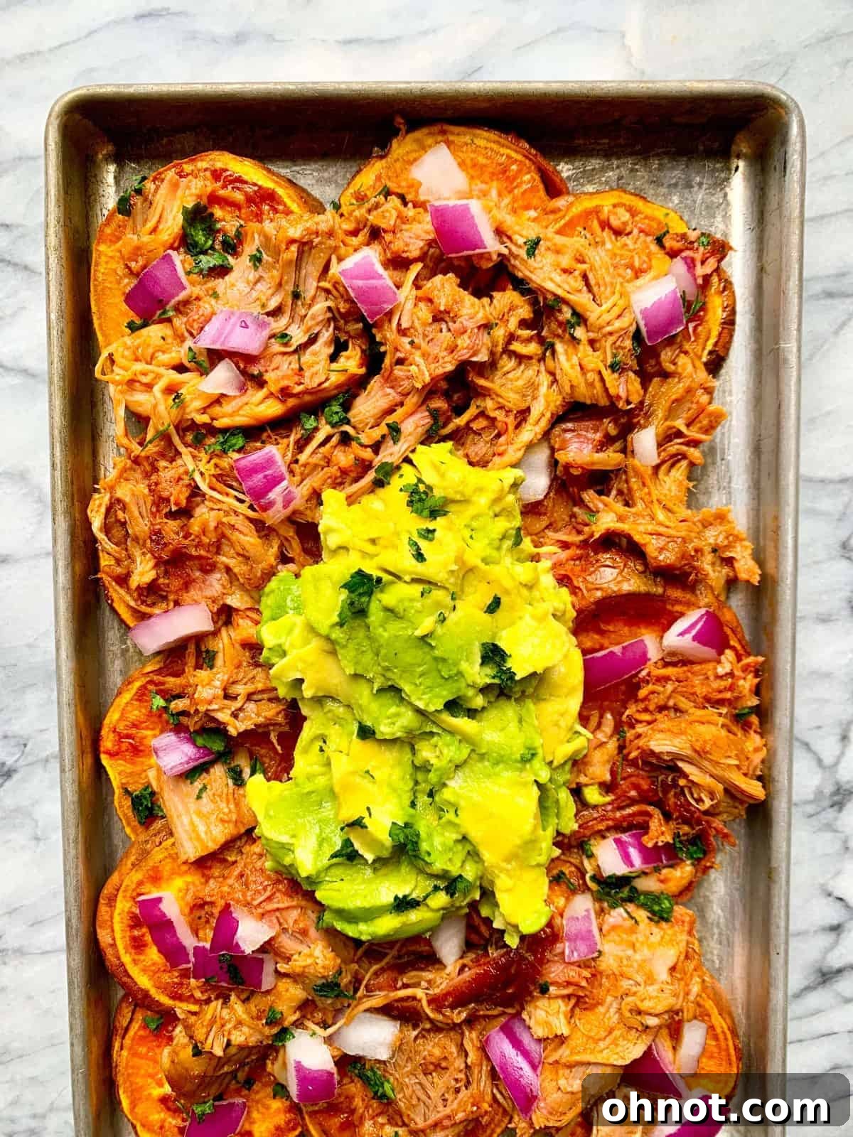Whole30 Pulled Pork Sweet Potato Nachos, featuring smoky pork on crispy sweet potato rounds with fresh toppings.