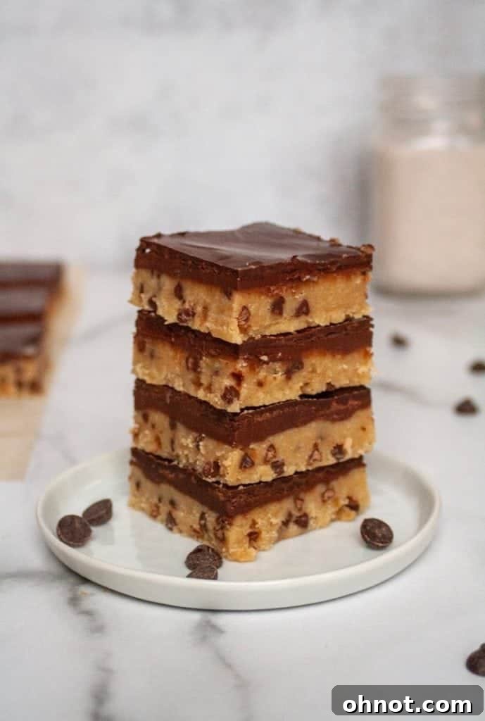 Sliced paleo cookie dough bars on a wooden board, ready to serve.