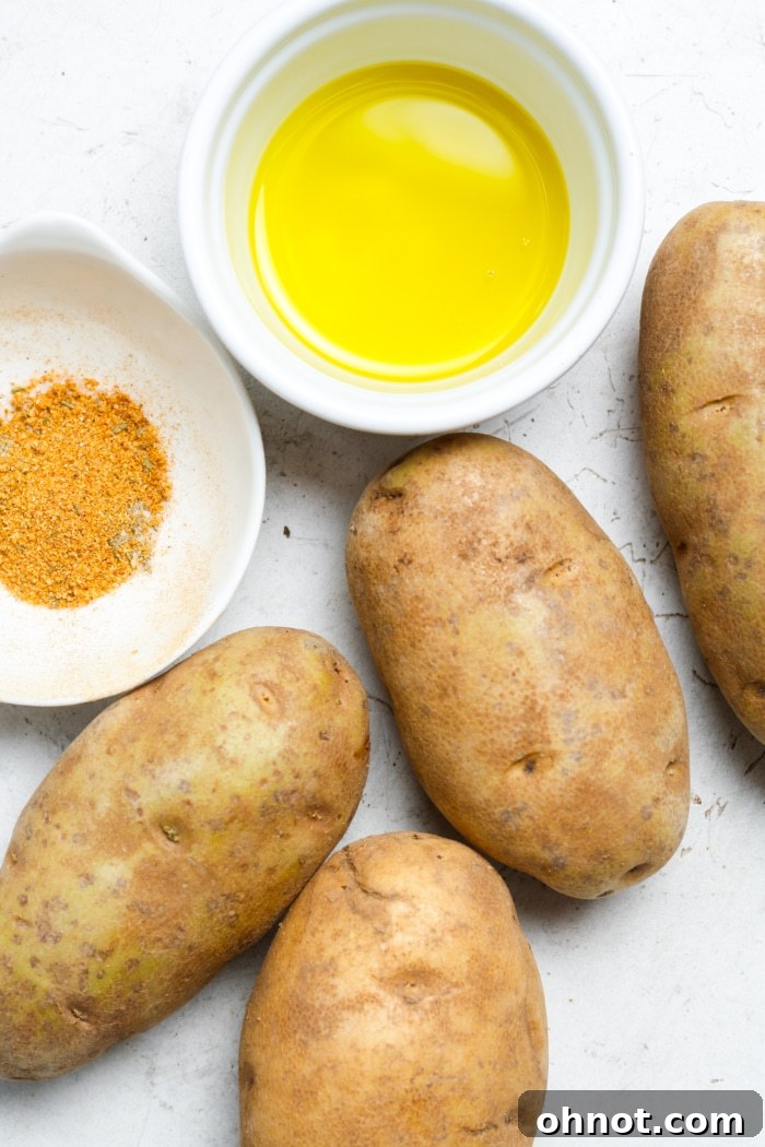 Fresh Russet potatoes, olive oil, and seasoning for air fryer potato wedges.