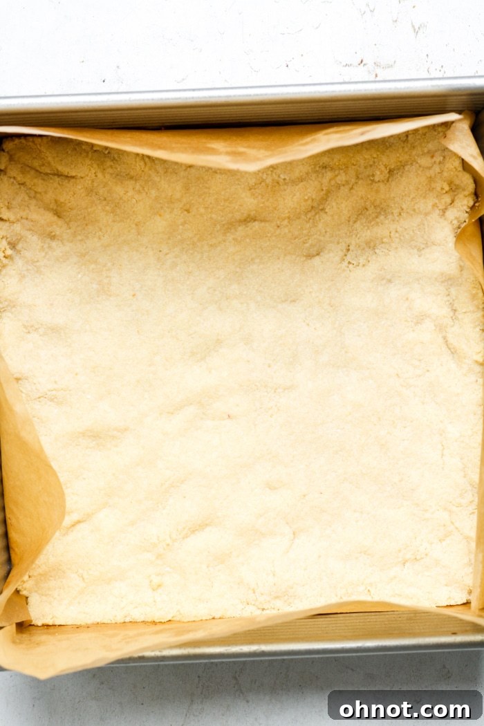 Freshly baked shortbread crust in a pan, still warm.