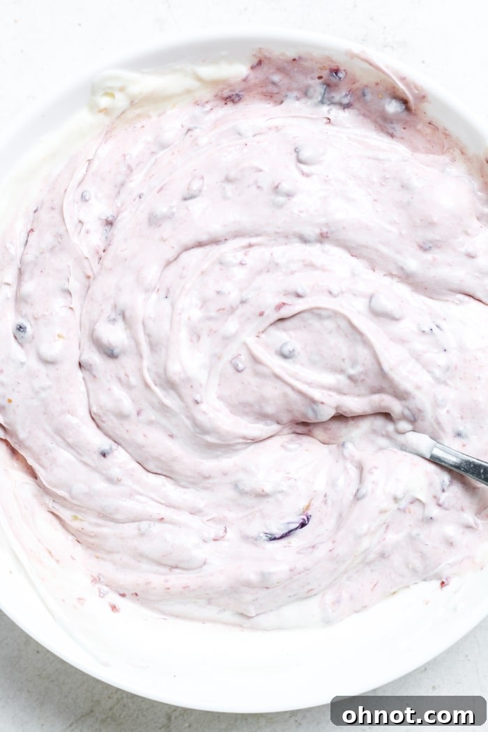 Blueberry frosting in a bowl.