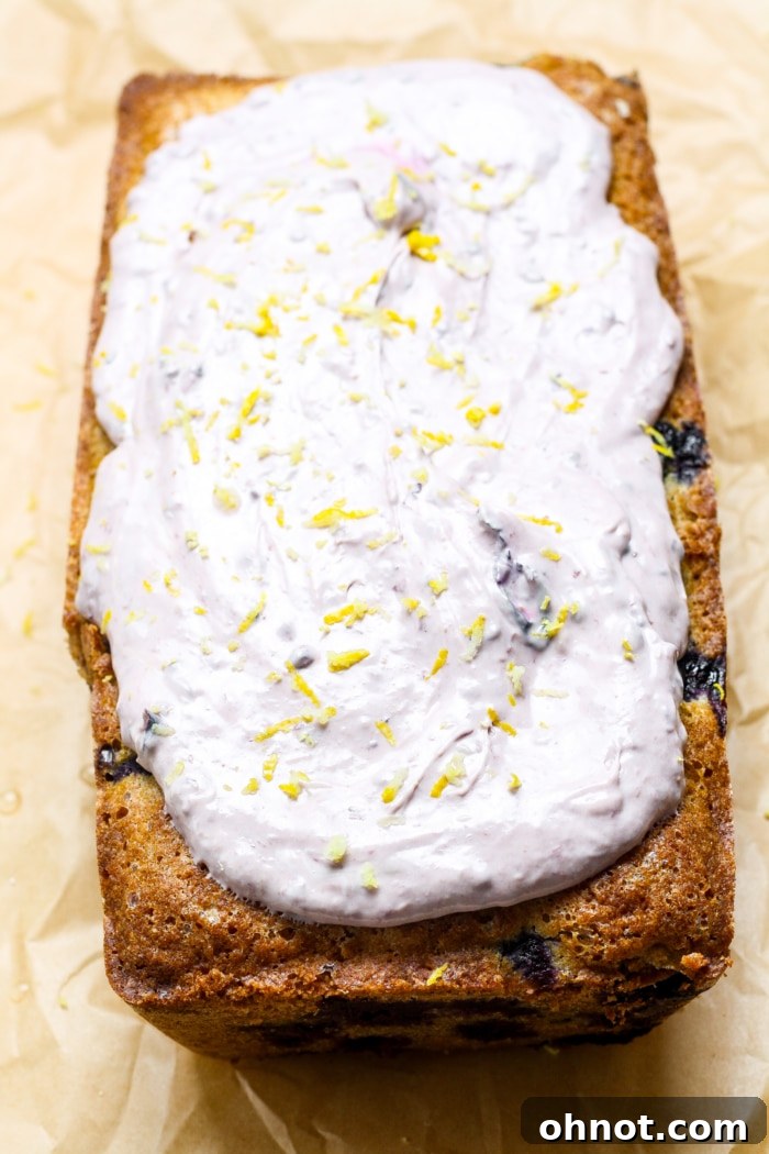 Lemon blueberry bread with creamy blueberry frosting.