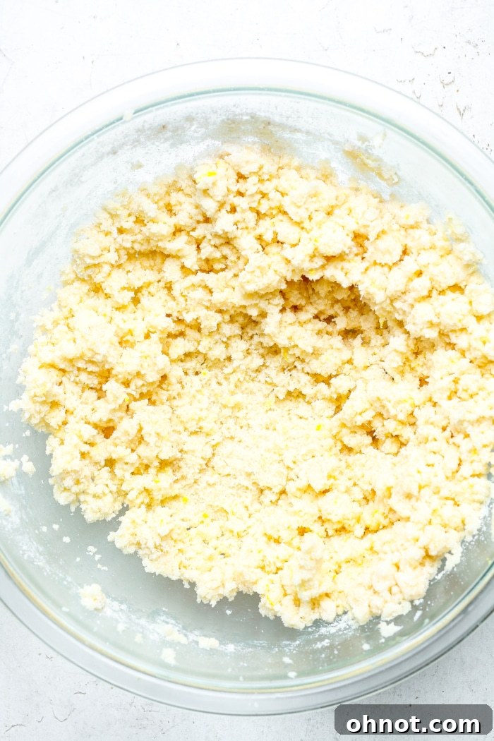 Crumbly butter and flour mixture in a bowl.