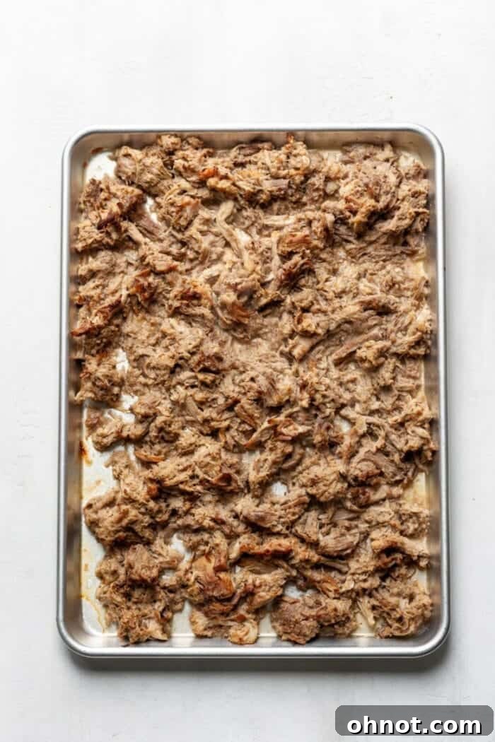 Crispy Keto Carnitas on a baking sheet after broiling.