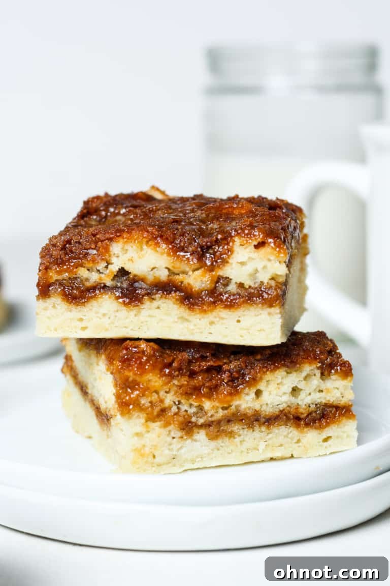 A slice of moist vegan coffee cake with a crumble topping on a white plate.