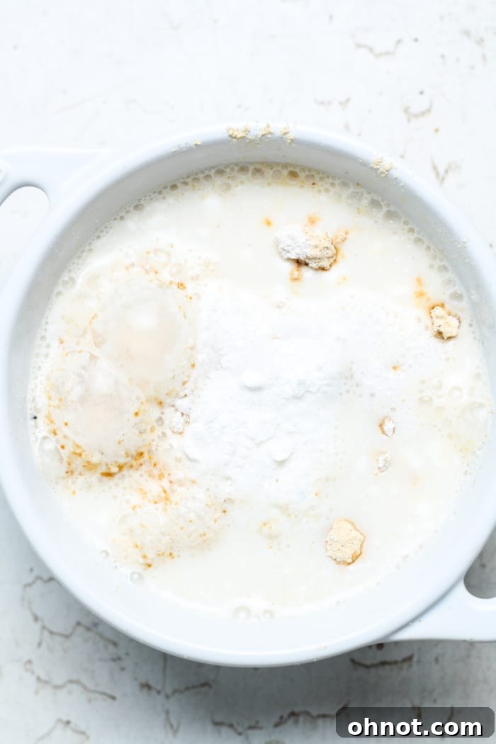 Milk and protein powder in bowl.