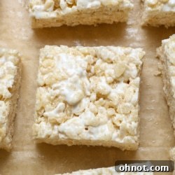 A top-down view of a completed batch of gluten-free rice krispies treats in a pan