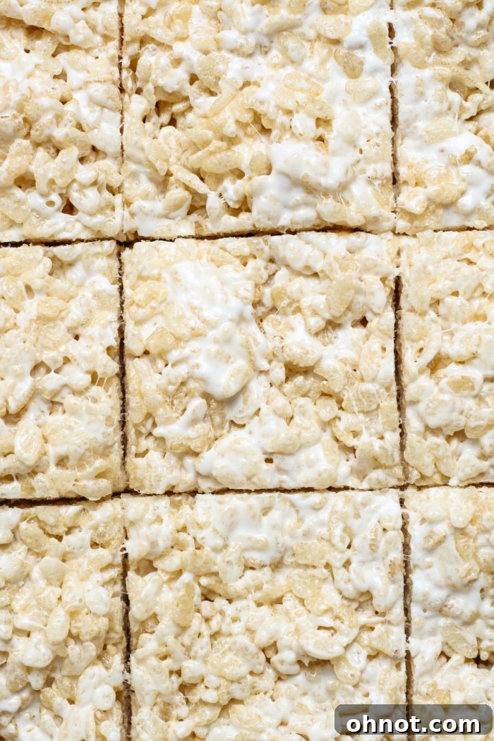 Freshly made homemade gluten-free rice krispies treats sliced and ready to be served