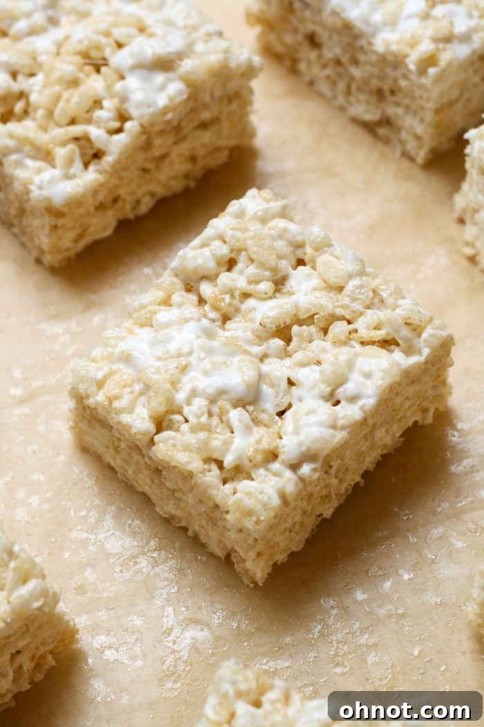 Perfectly cut gluten-free rice krispies bars arranged on a white platter