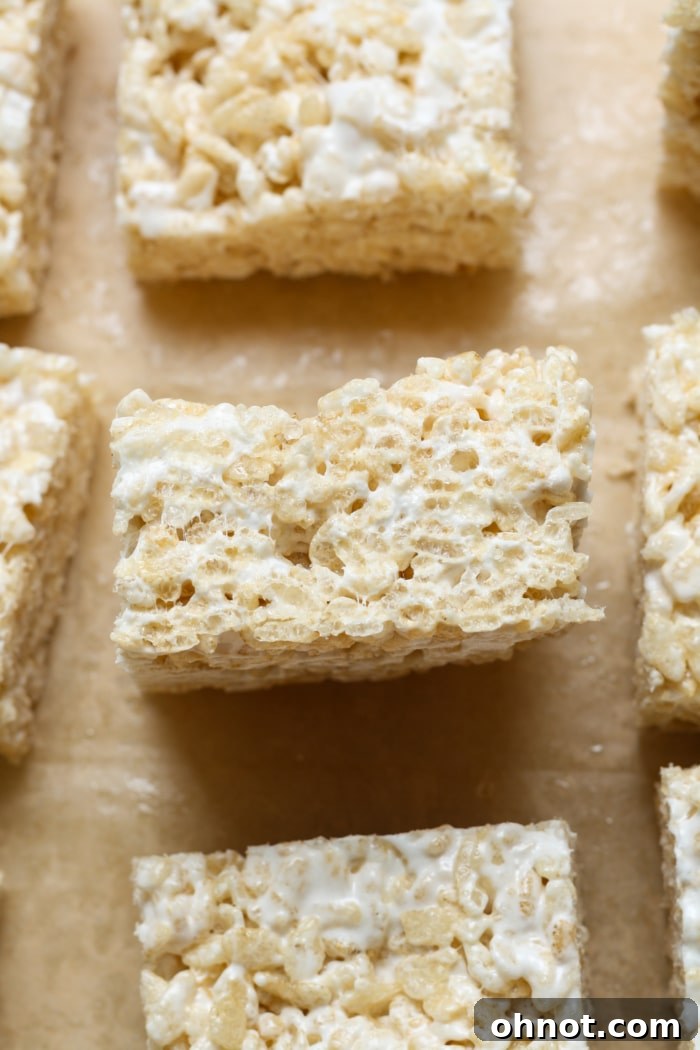 Close-up view of a perfectly square gluten-free rice krispies treat