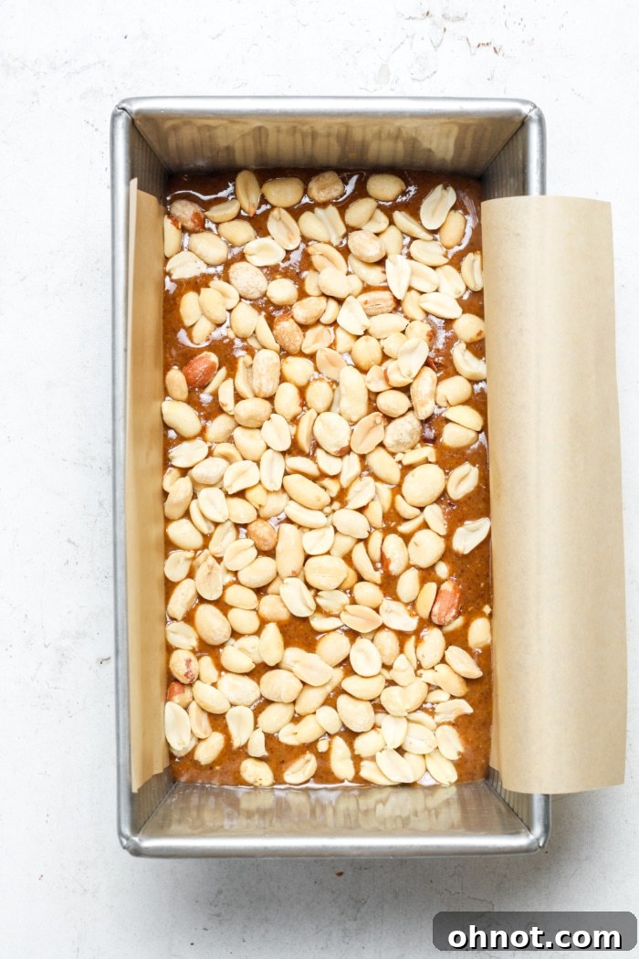 Assembled peanut caramel bars in a loaf pan, before freezing.