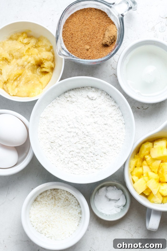 Assorted ingredients for pineapple banana bread, including flour, sugar, and fruits.