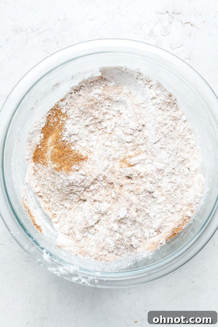 Dry ingredients for banana bread in a mixing bowl: gluten-free flour and coconut sugar.