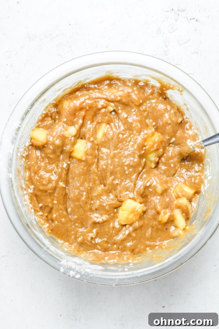 Banana bread batter with pineapple chunks folded in.