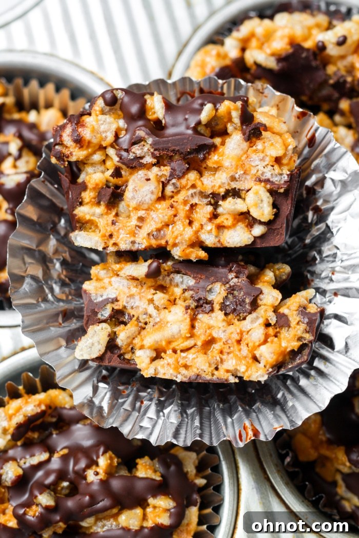 Close up of a batch of healthy peanut butter cups, showing their rich texture.