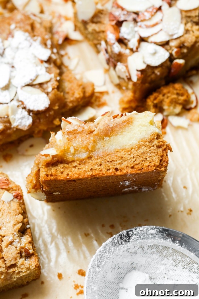 Gooey almond croissant blondie bars on a cutting board.