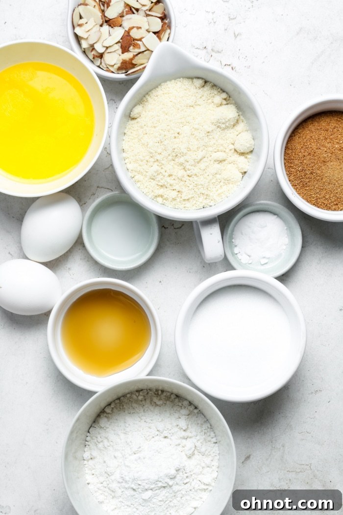 Ingredients for almond croissant blondies arranged on a white surface.