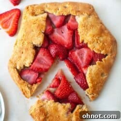 A gluten-free strawberry galette on parchment paper.