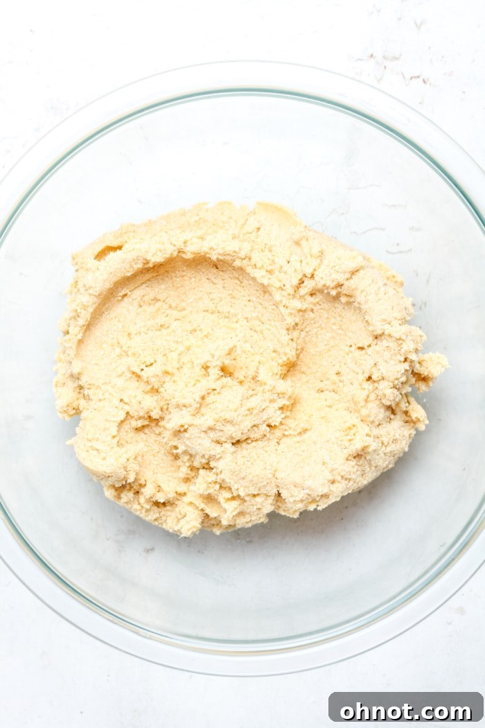 Light cookie dough in bowl.