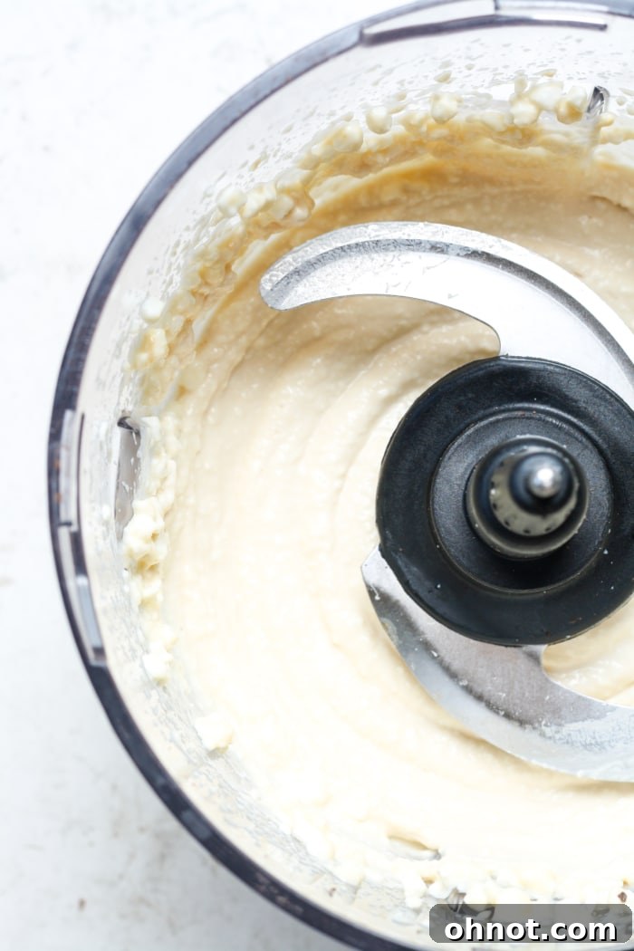 Close-up of the smooth, creamy cottage cheese base after initial blending.