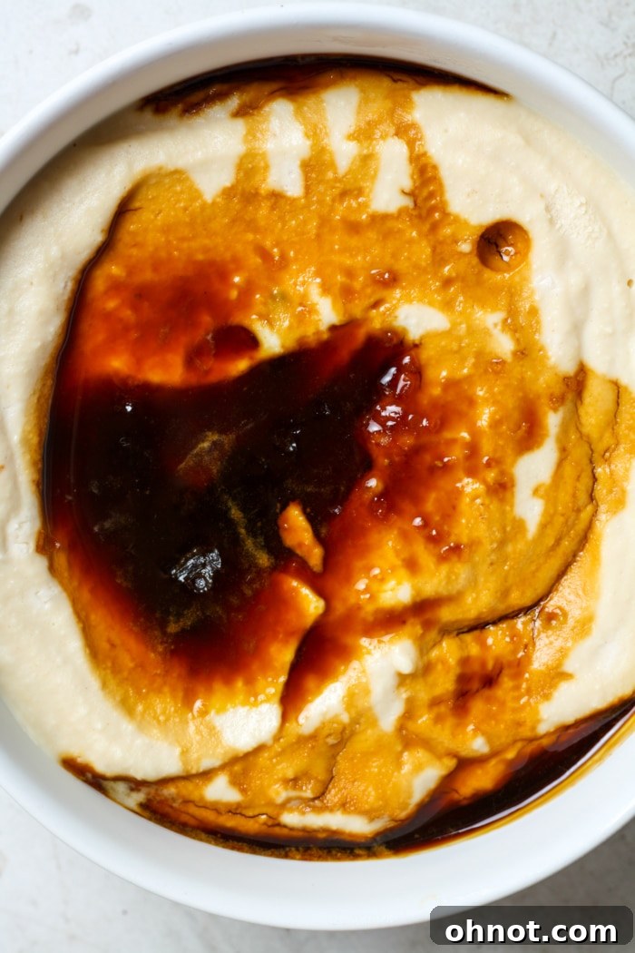 A scoop of the finished cottage cheese ice cream, showcasing its creamy texture.