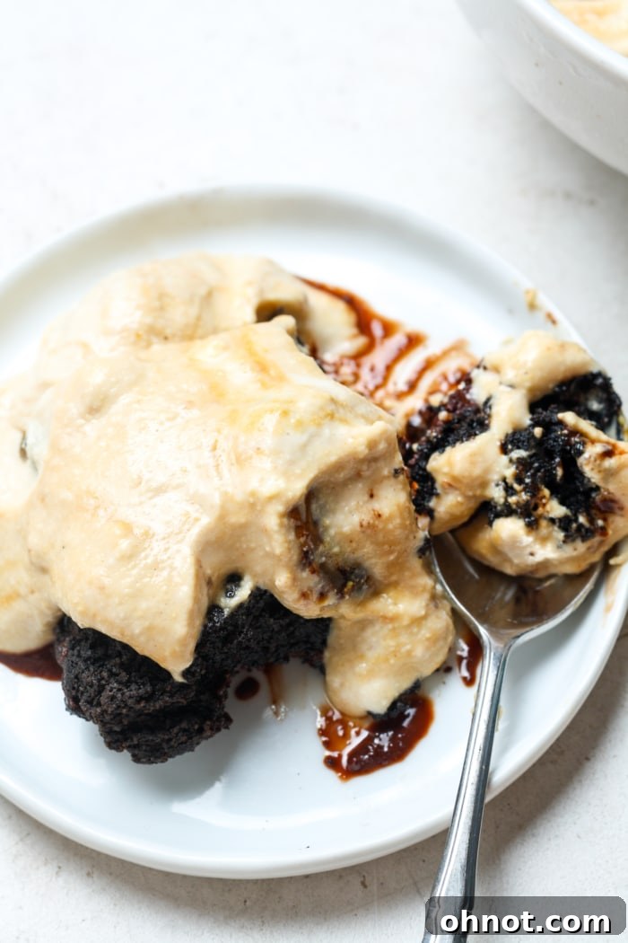 A decadent serving of cottage cheese ice cream alongside a warm brownie, offering a perfect dessert pairing.