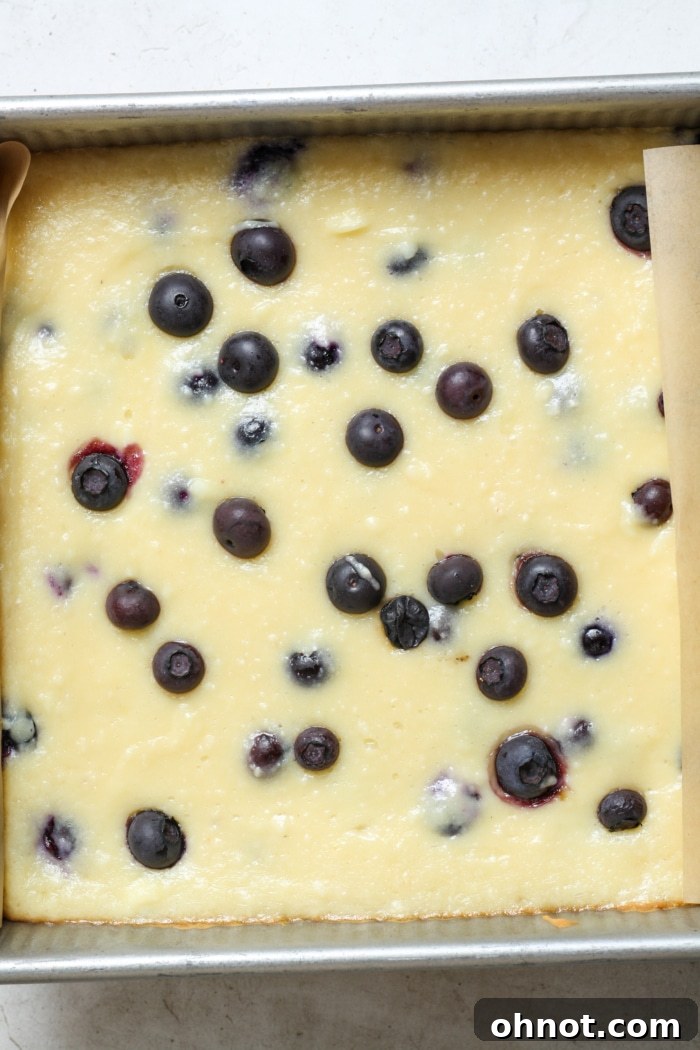 Baked berry cheesecake bars cooling.