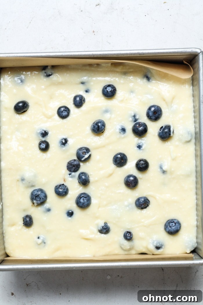 Blueberry cream bars in a baking pan.