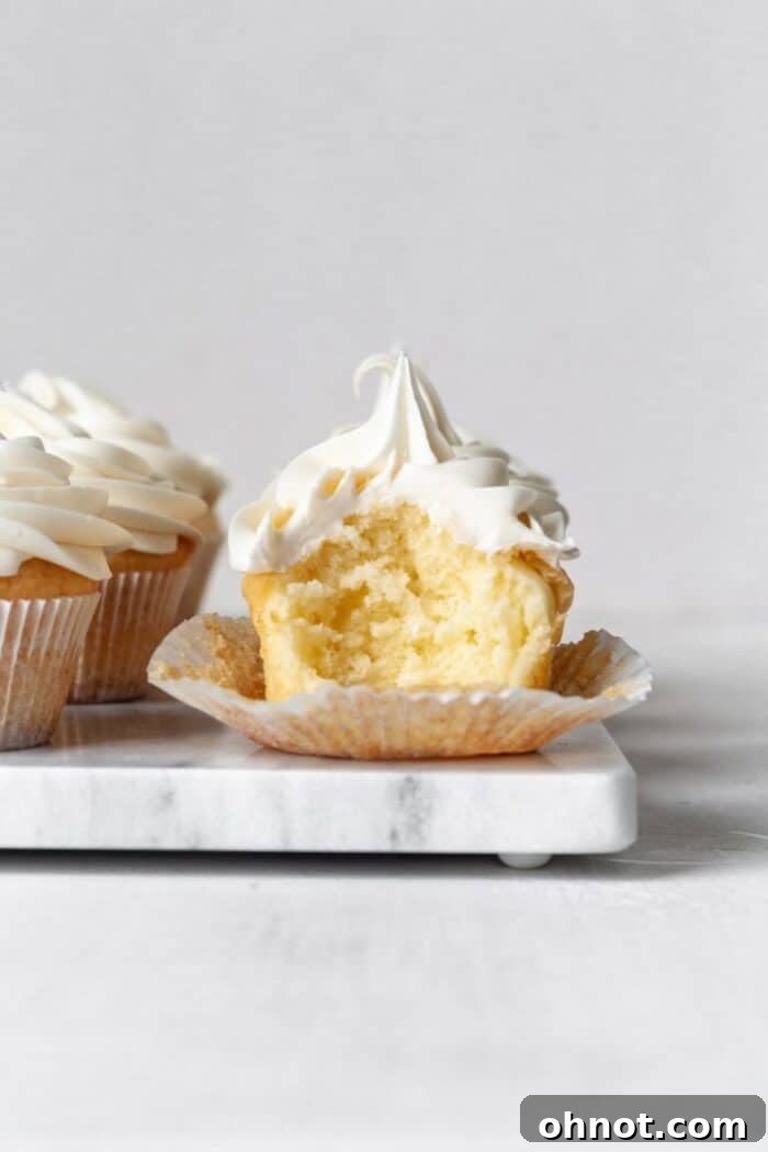 Paleo Vanilla Cupcakes on a marble slab, perfectly frosted and ready to enjoy.