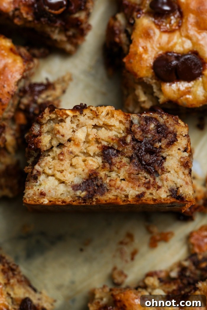 Close-up of golden brown banana bread bars, showing their soft texture and potential for delicious mix-ins.