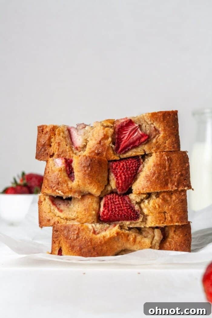 A loaf of Paleo strawberry banana bread, freshly baked and golden brown.