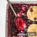 Gluten free blueberry cobbler in a white casserole dish.