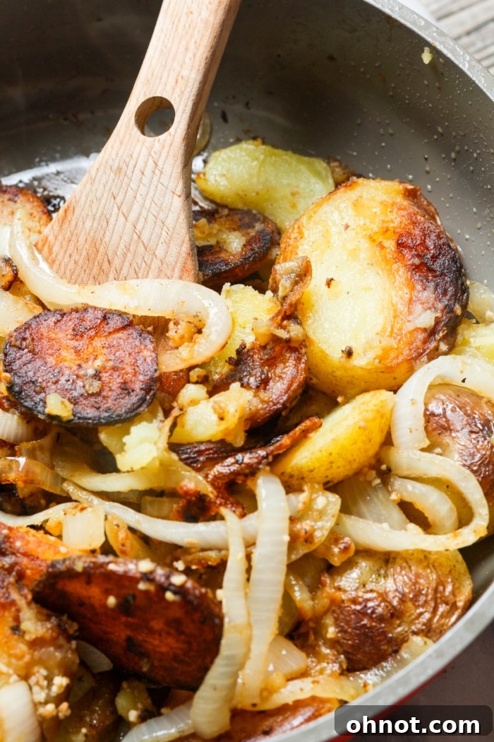 Golden brown potatoes with onions in a skillet