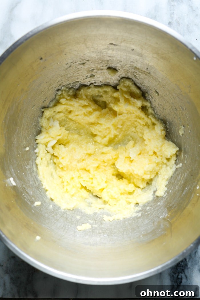 Yellow dough in mixing bowl.