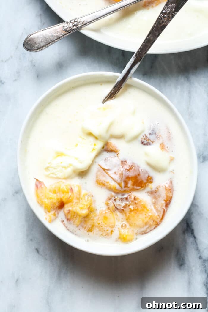 Vanilla ice cream with baked fruit, garnished enticingly.