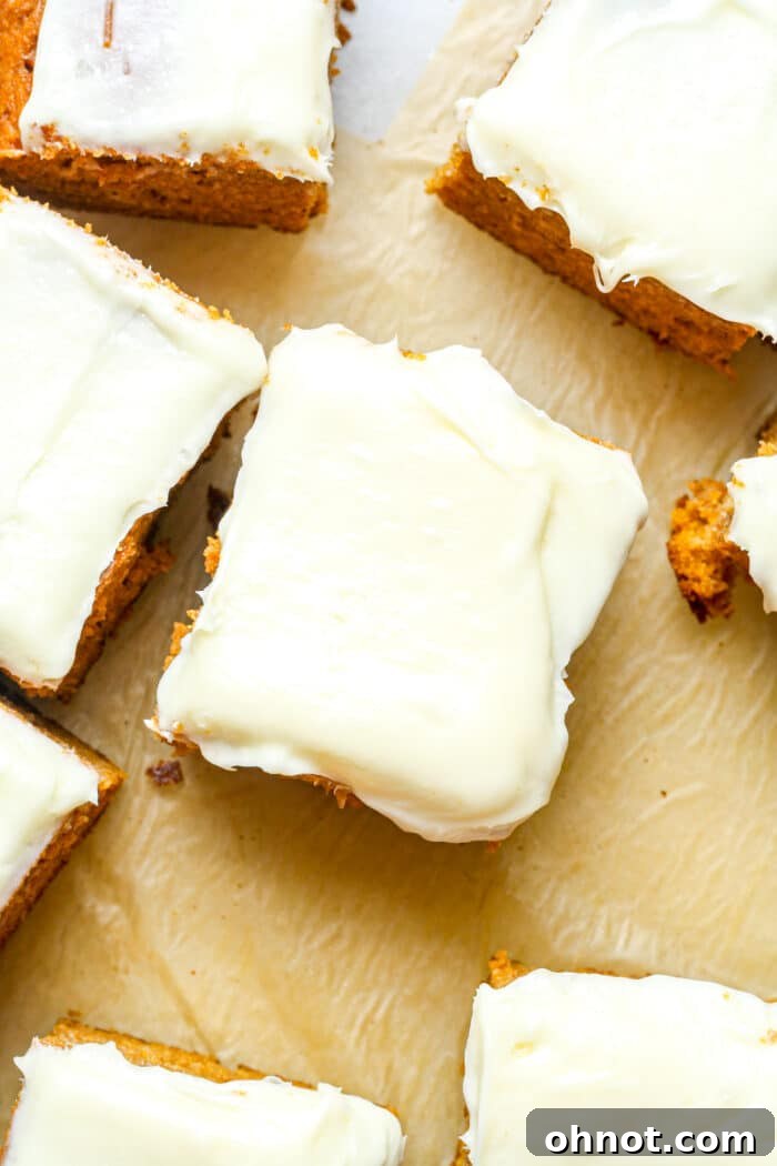 An autumn-themed gluten-free pumpkin cake decorated with frosting and sprinkles.