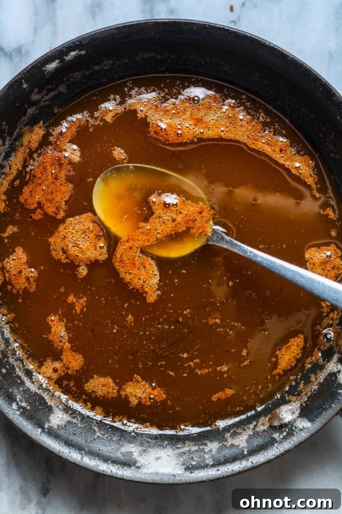 Butter browning in a skillet, showing a rich caramel color.