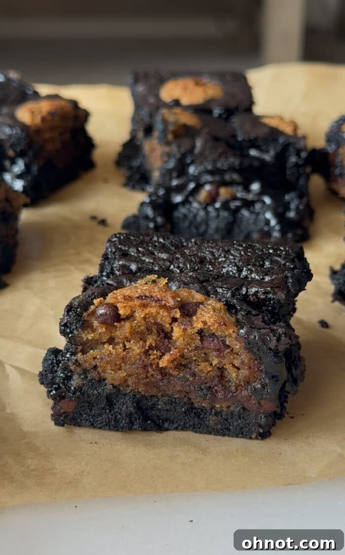 Freshly baked brownie cookie bars in a pan, ready to cool.