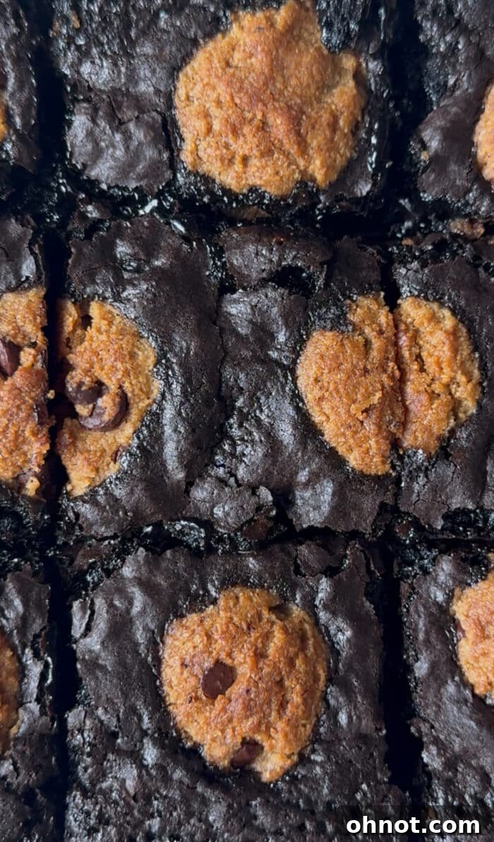 Stacked gluten-free brookie brownies, showing the rich chocolate layers.