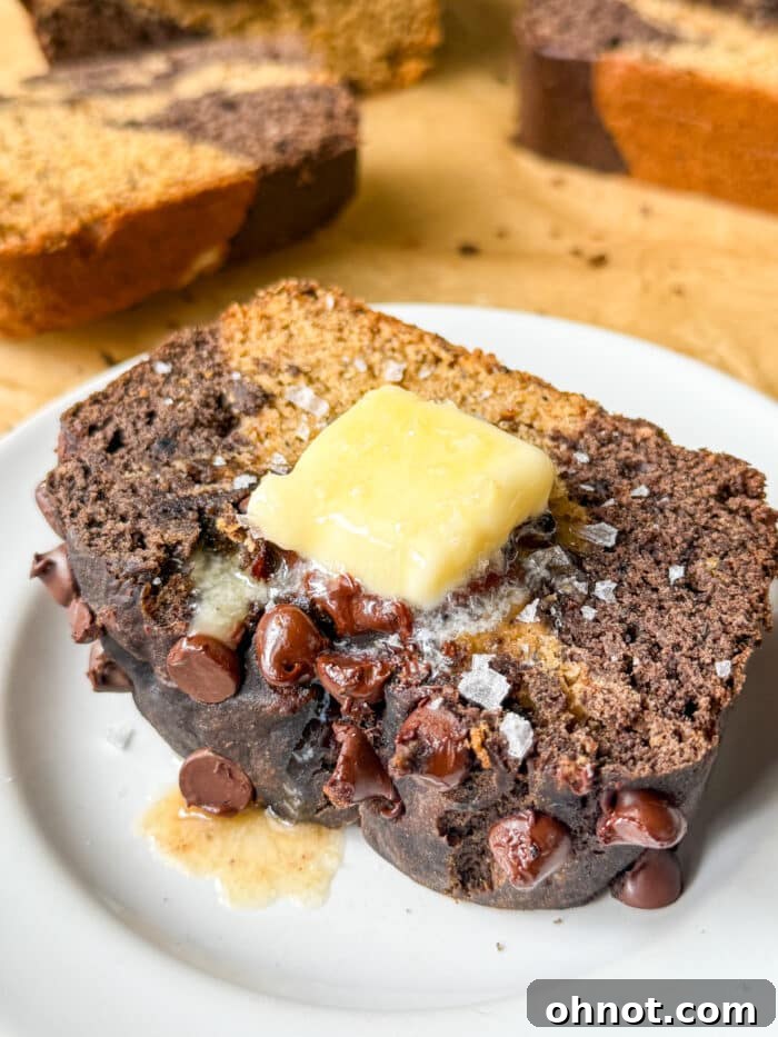 Marble banana bread, sliced to show the beautiful chocolate swirl.