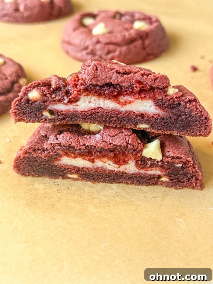 Perfectly baked red velvet cheesecake cookies arranged on a cooling rack, showcasing their vibrant red hue and delicious texture.