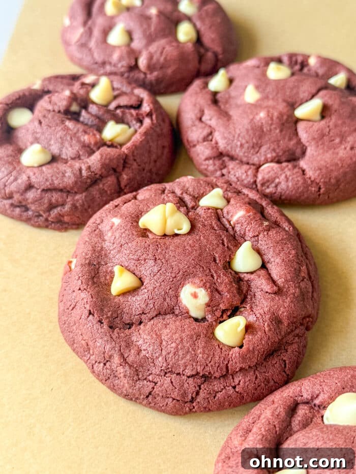 A vibrant group of red velvet cheesecake cookies on a cooling rack, highlighting their festive and inviting appearance.