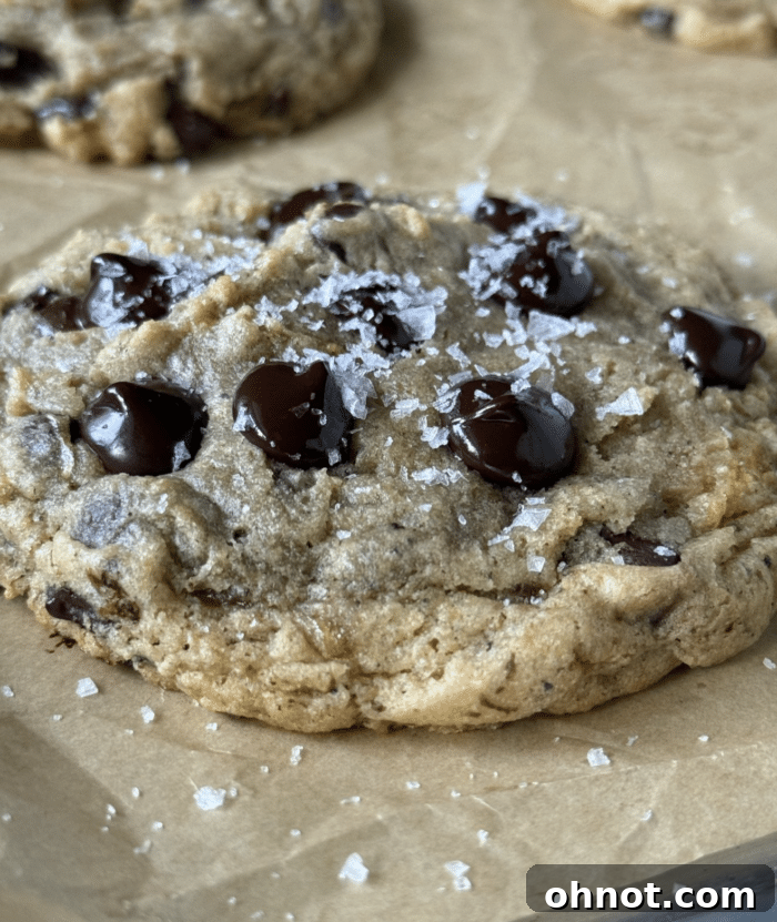 Warm banana chocolate chip cookies garnished with flaky sea salt.