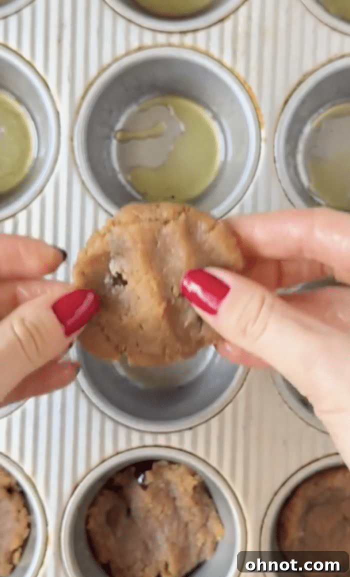 Fingers with cookie dough.