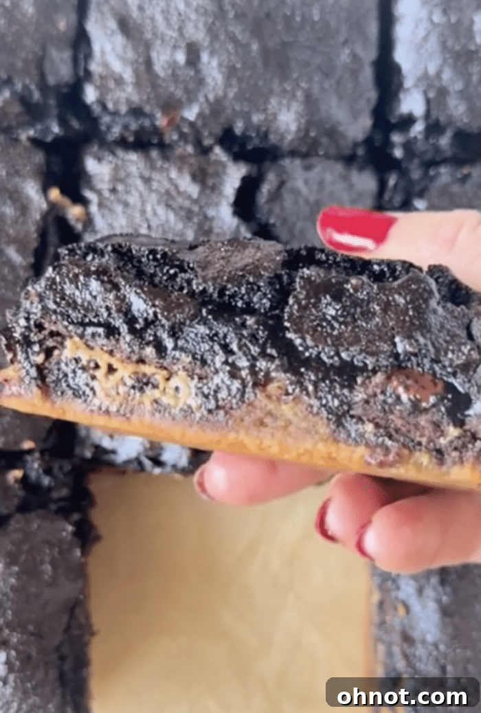 Close-up shot of a stack of Stuffed Brookies, highlighting the soft, fudgy texture and visible layers.