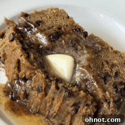 Close-up of a slice of Cookie Dough Peanut Butter Bread showing gooey cookie dough pockets and chocolate chips.